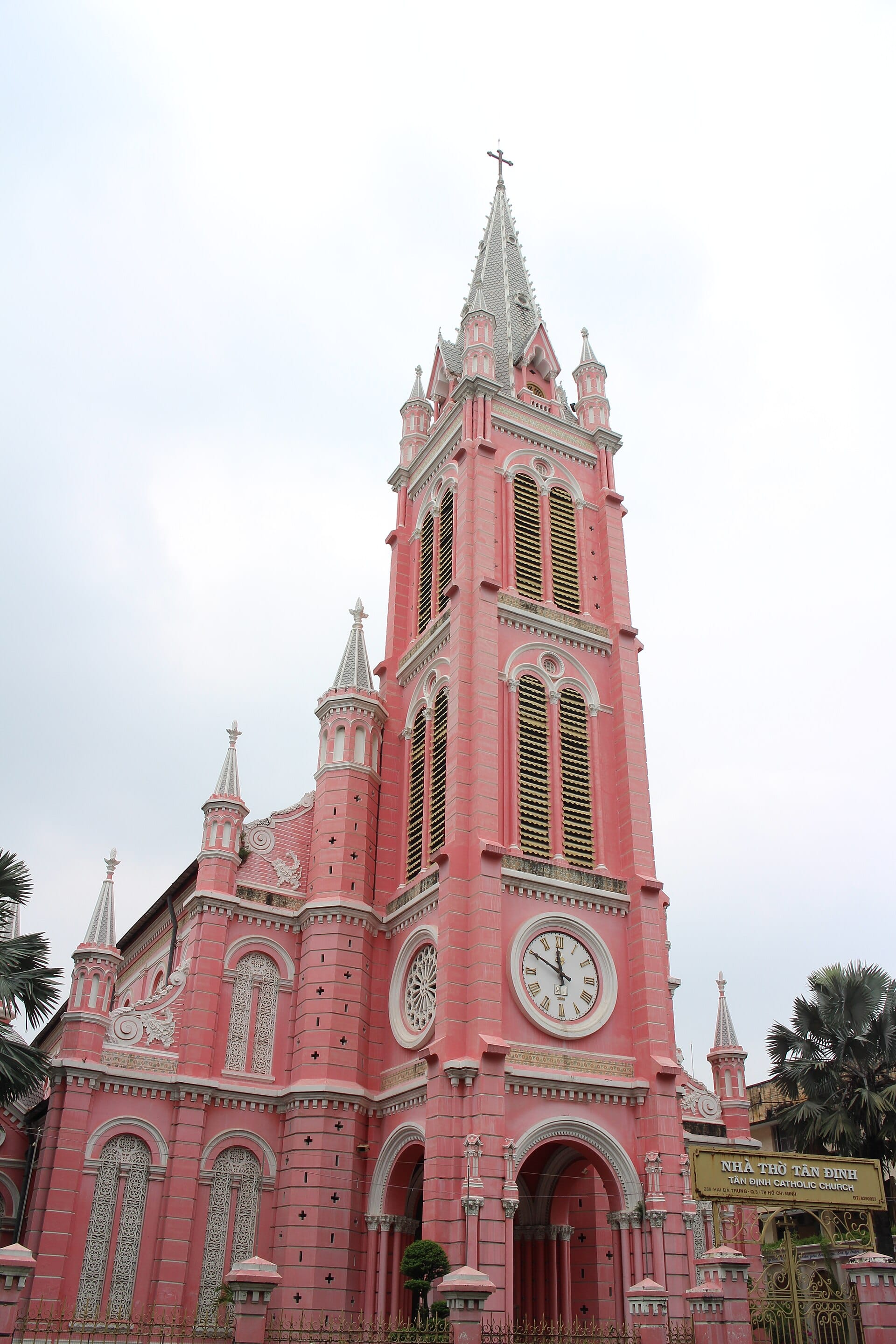 The pink facade and bell tower of Tan Dinh Church, the most photographed sight in the ward. Photo: Suicasmo, CC BY-SA 4.0