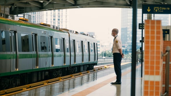 An elevated metro track in Hanoi stretching toward the city skyline